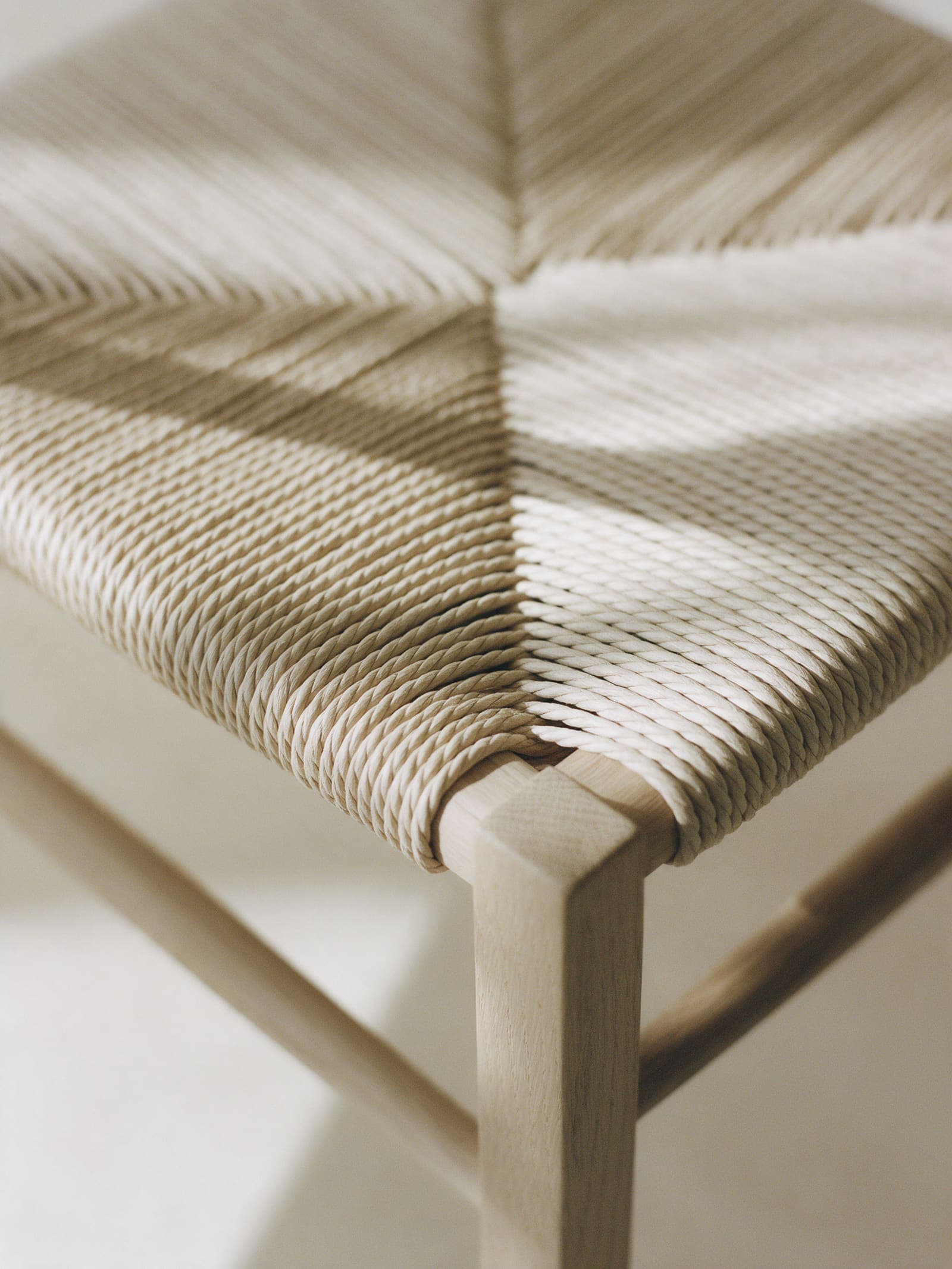 Close view of a hand-woven paper cord seat