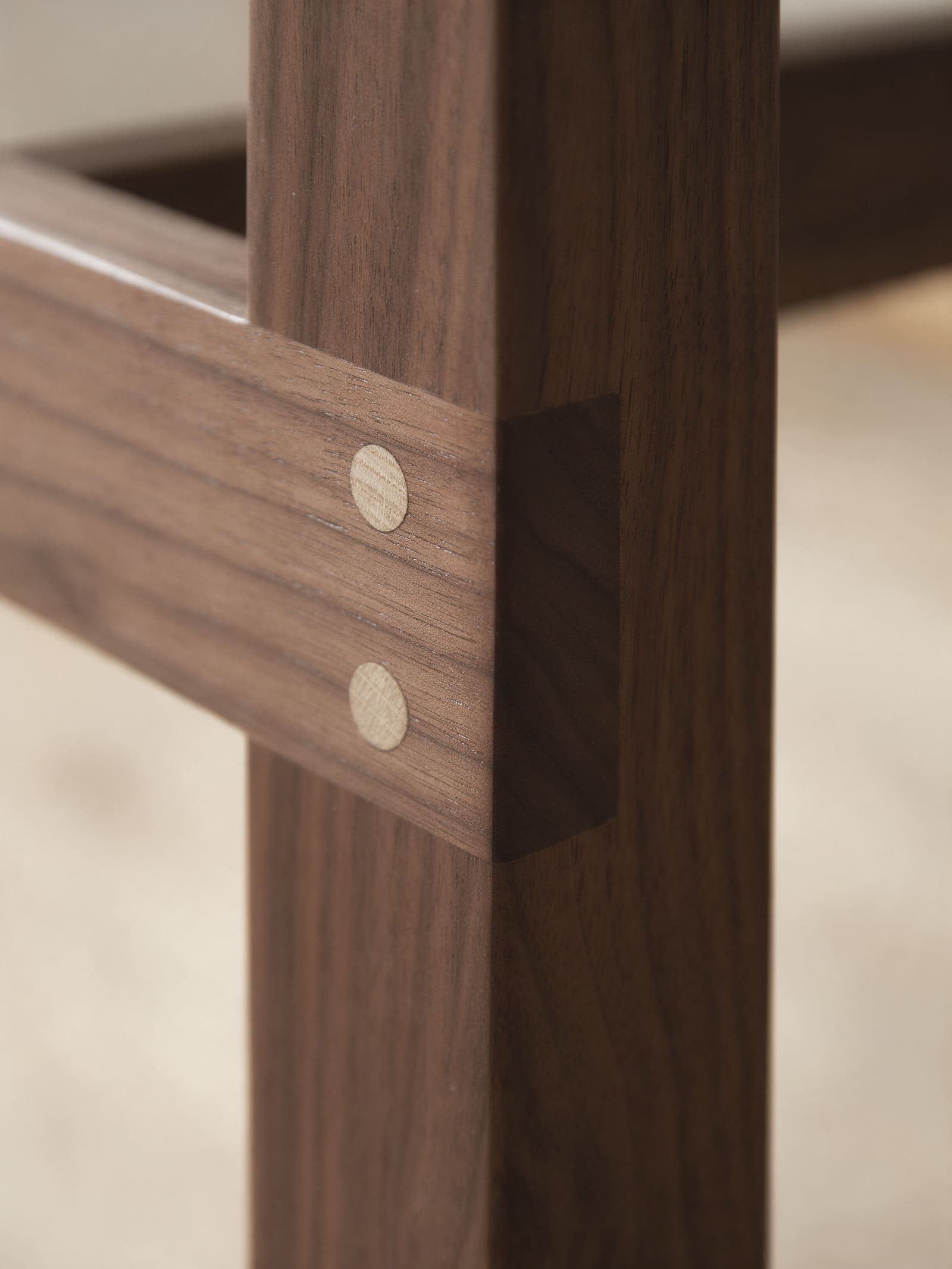 Oak pegs driven through a walnut joint