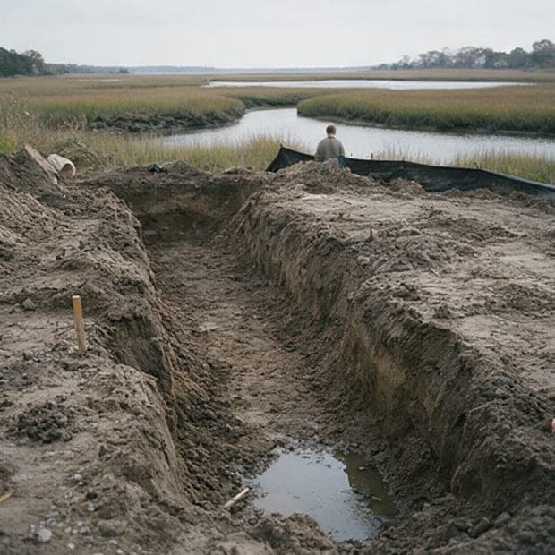 Creek House, week 5: footing trenches dug, groundwater at the bottom.