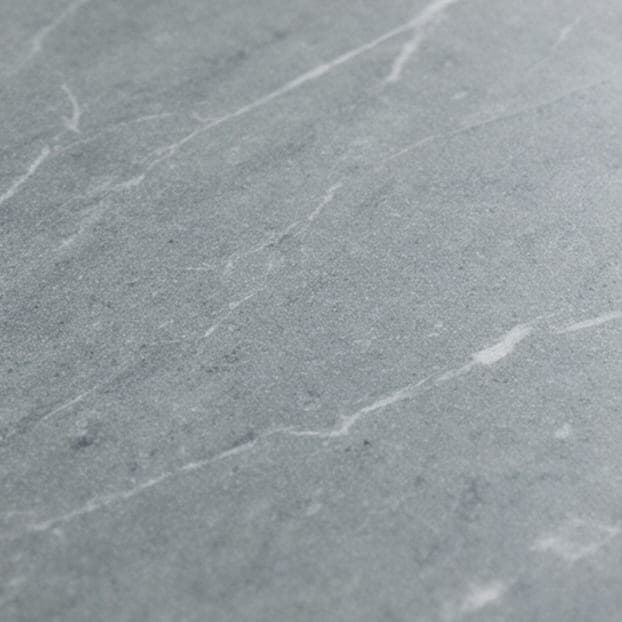 Honed soapstone with pale veining.