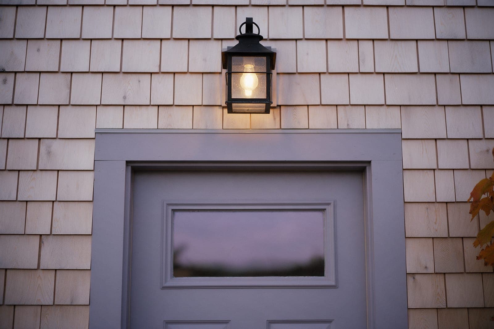 The lantern lit over the side door, where cats come in.