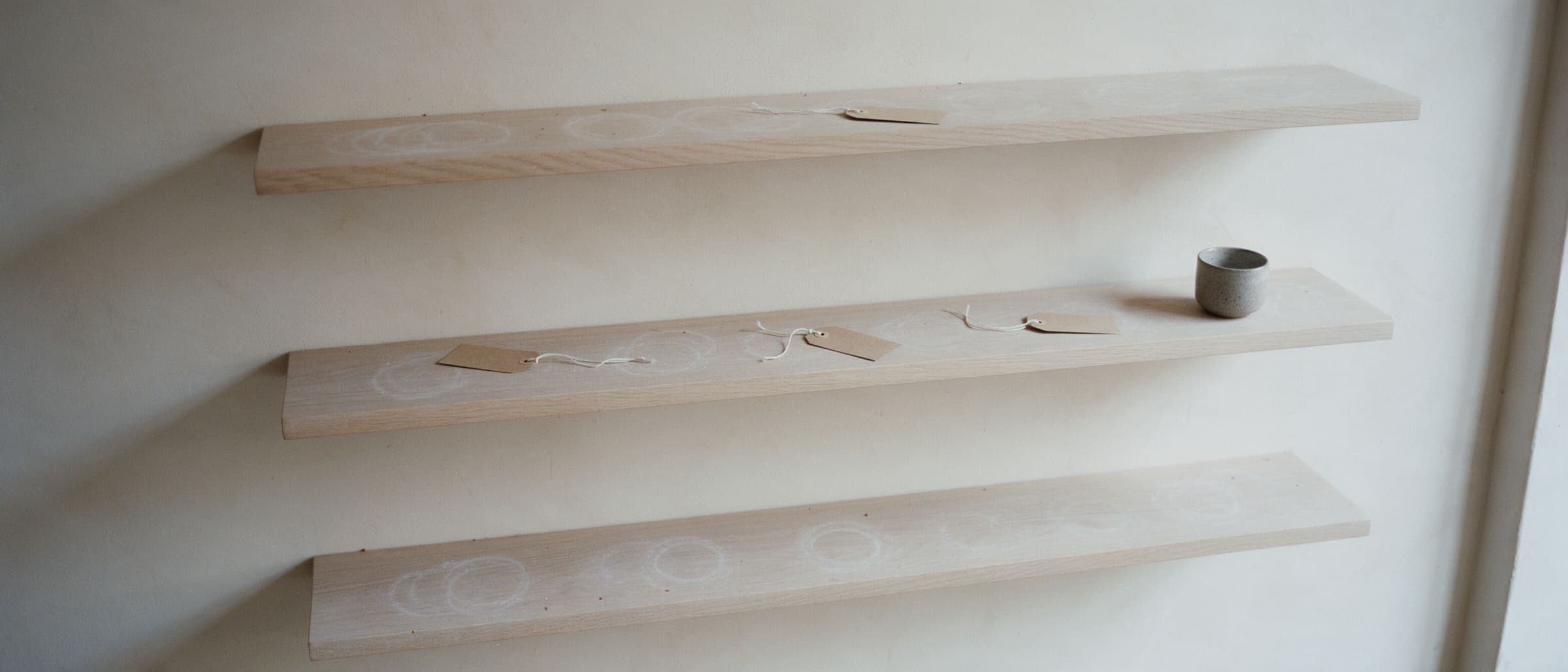 The shop shelves after a sell-out, rings in the dust and one cup left
