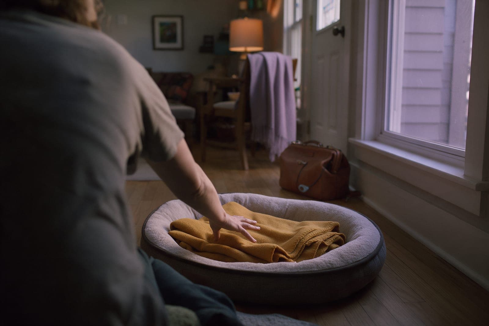 A quiet room at home, with a blanket on the floor.