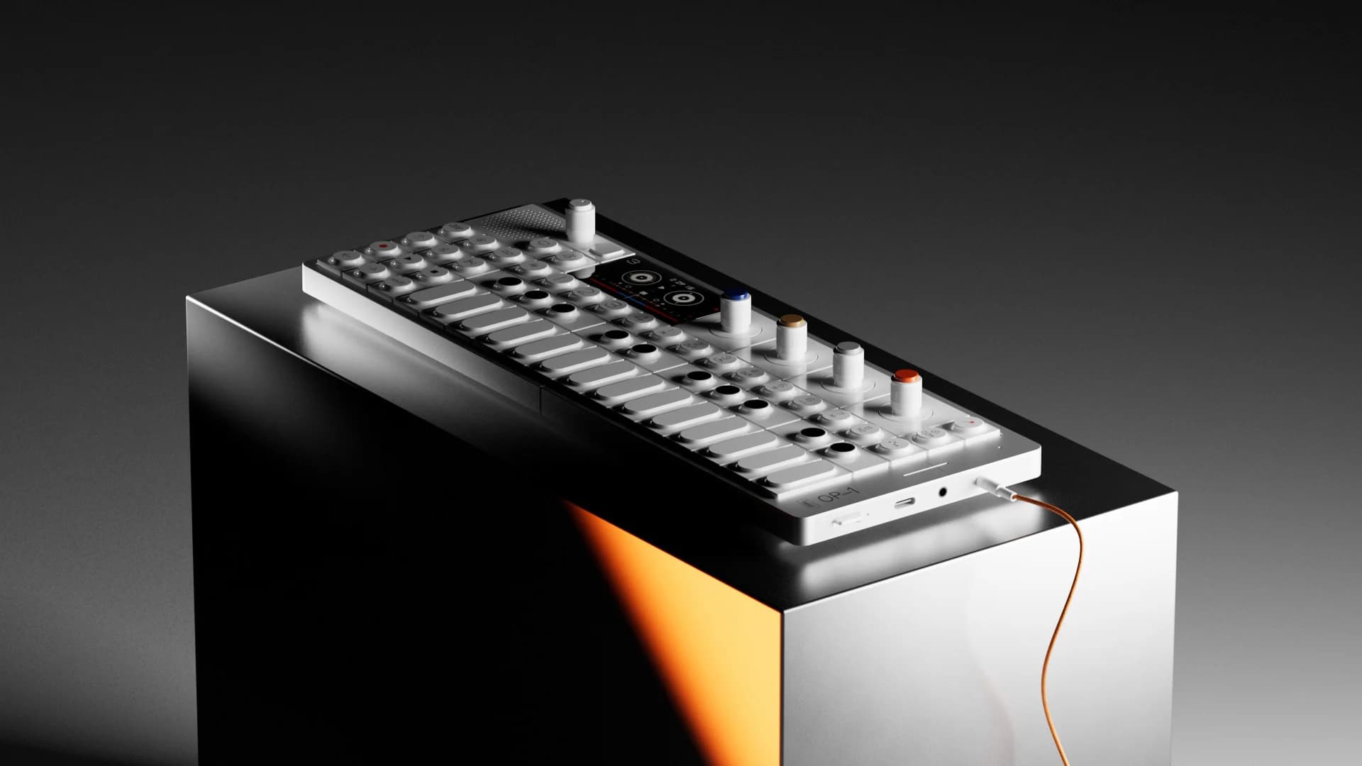 CG study of the OP-1 Field resting on a polished black block, lit with a warm orange edge.