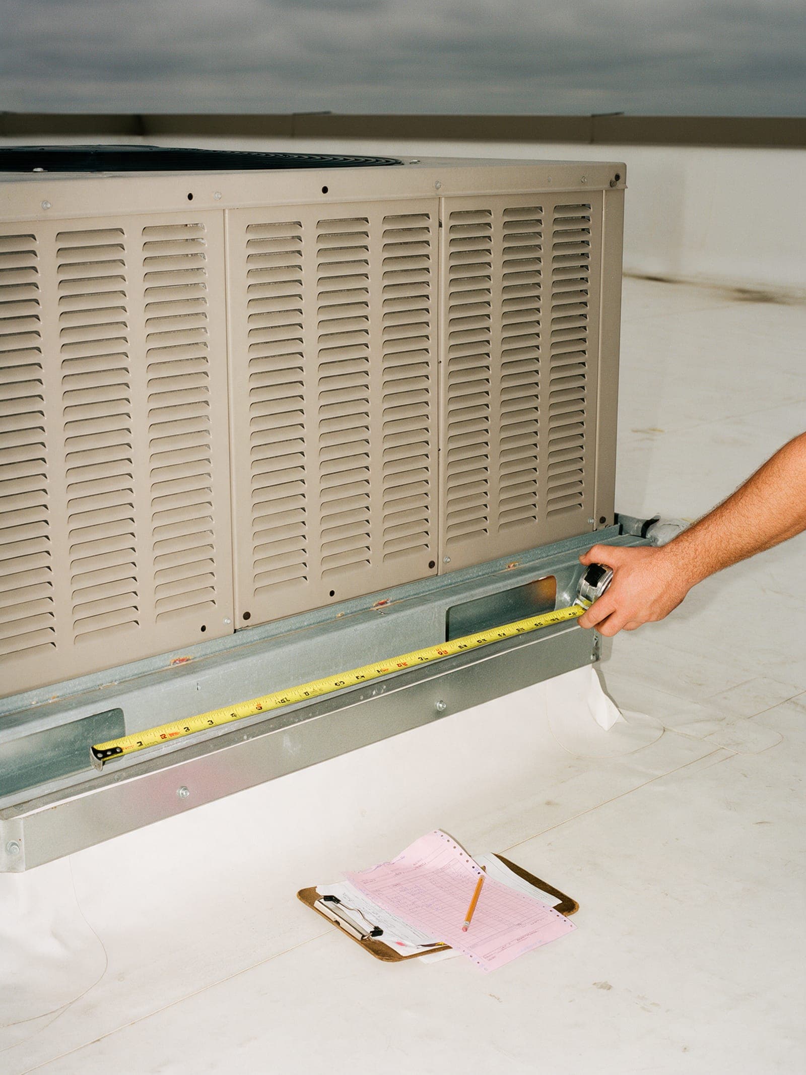 Commercial rooftop ductwork and a carbon estimate pad.