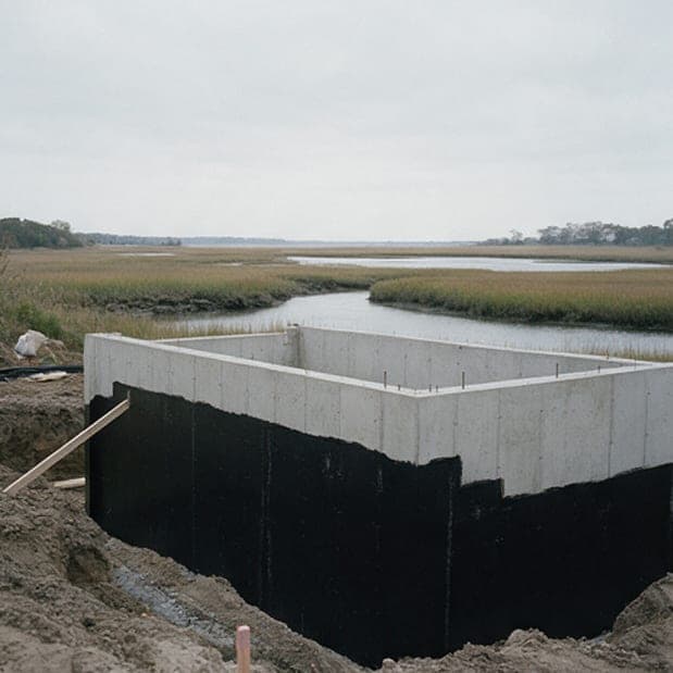 Creek House, week 11: foundation walls waterproofed below grade.